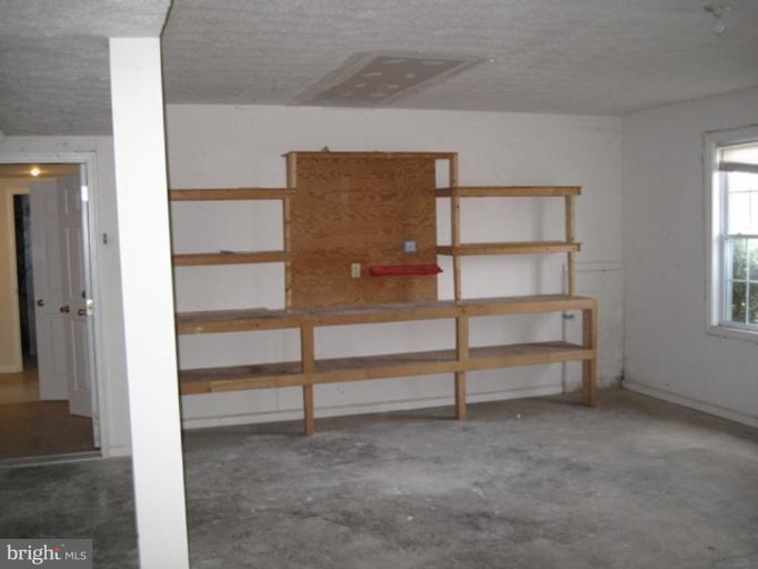 290 Ruebuck Road Clear Brook, VA 22624 - Photo 12 of 28 a view of an empty room with a fireplace
