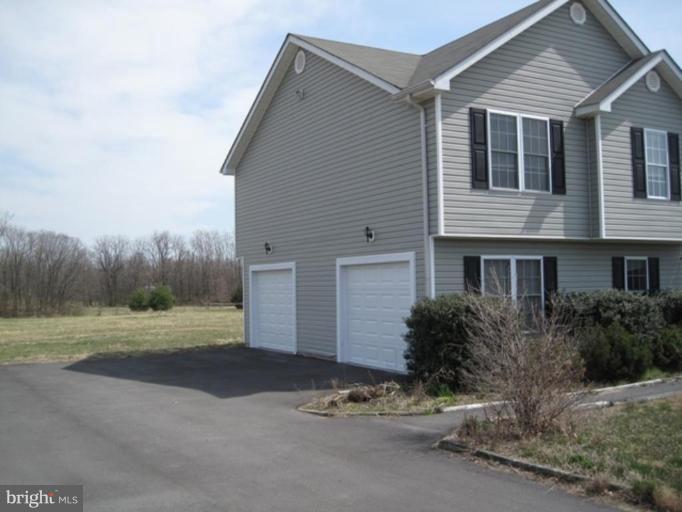 290 Ruebuck Road Clear Brook, VA 22624 - Photo 16 of 28 a front view of a house with a yard and garage