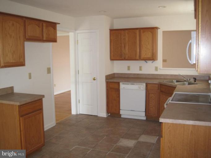290 Ruebuck Road Clear Brook, VA 22624 - Photo 3 of 28 a kitchen with a sink stove and cabinets