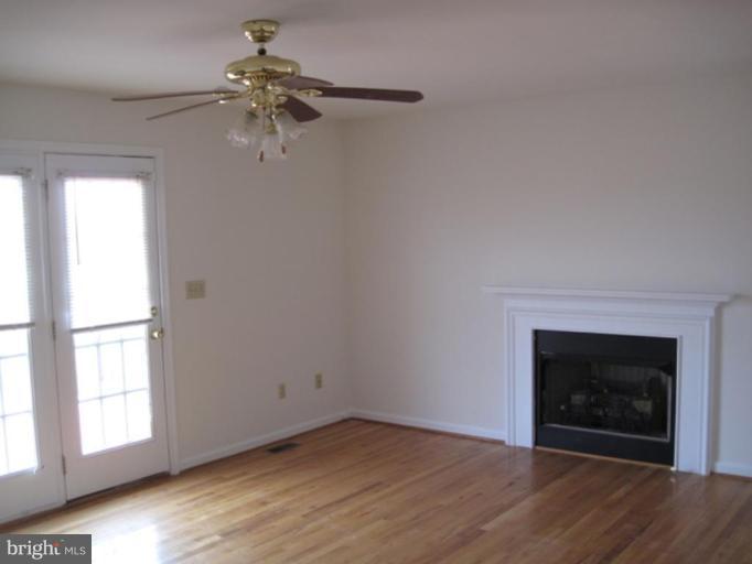 290 Ruebuck Road Clear Brook, VA 22624 - Photo 4 of 28 an empty room with windows and fireplace