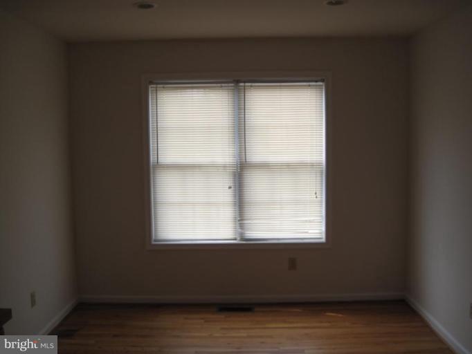 290 Ruebuck Road Clear Brook, VA 22624 - Photo 5 of 28 a view of an empty room with wooden floor and a window