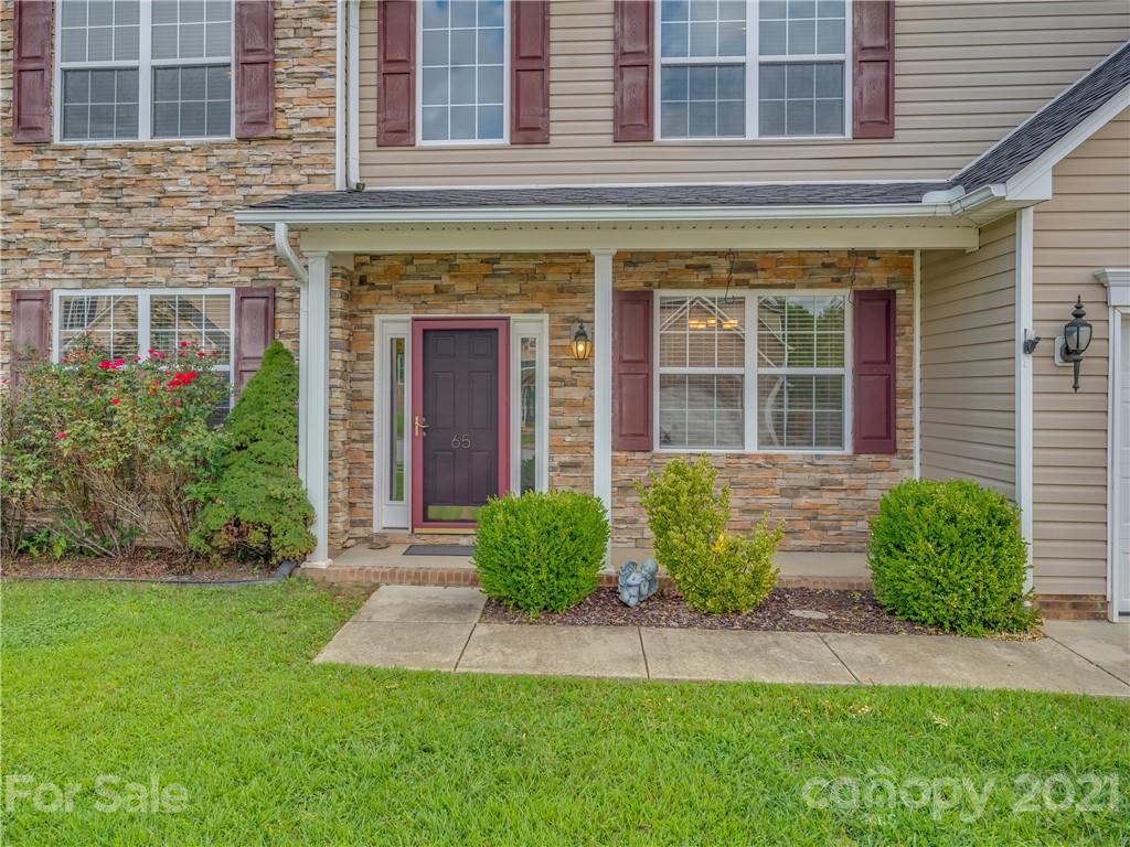 65 Wildbriar Road, Unit 49 Fletcher, NC 28732 - Photo 2 of 43 a view of brick house with a large windows and flower plants