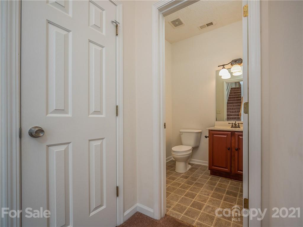 65 Wildbriar Road, Unit 49 Fletcher, NC 28732 - Photo 17 of 43 a bathroom with a toilet and a sink