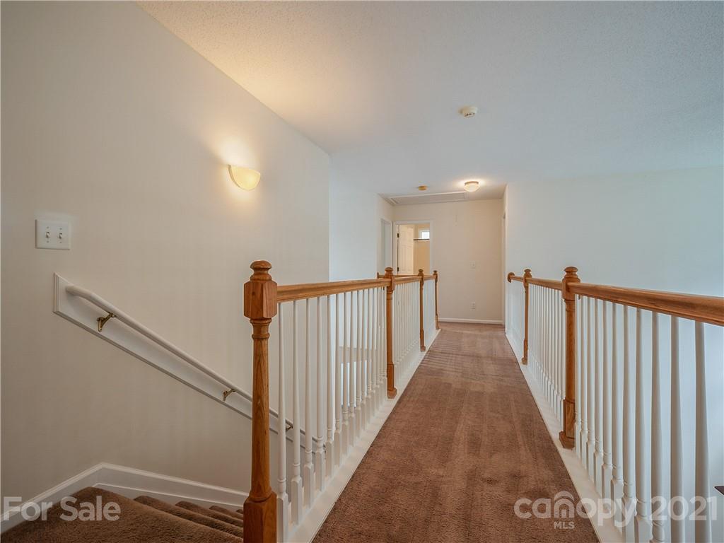65 Wildbriar Road, Unit 49 Fletcher, NC 28732 - Photo 21 of 43 a view of a hallway with stairs