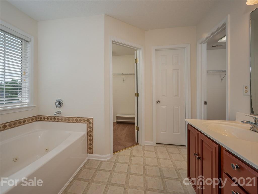 65 Wildbriar Road, Unit 49 Fletcher, NC 28732 - Photo 26 of 43 a spacious bathroom with a tub shower and sink
