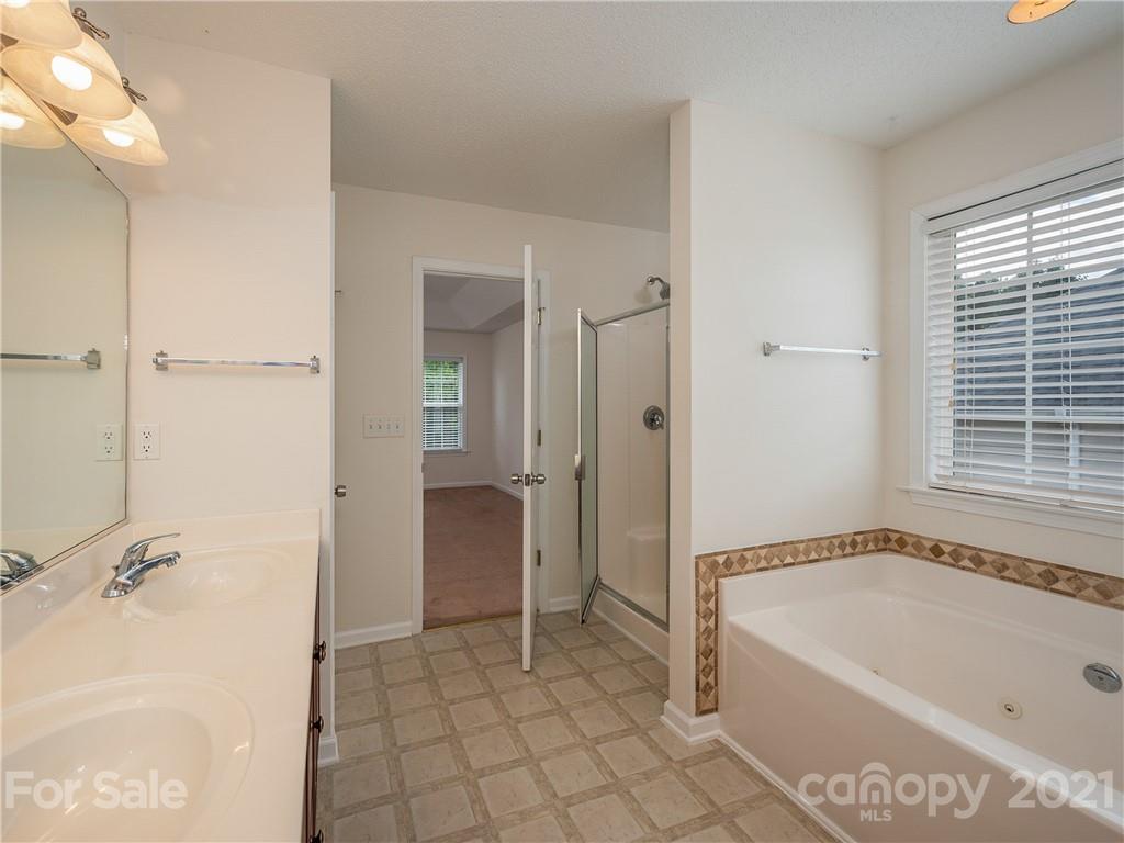 65 Wildbriar Road, Unit 49 Fletcher, NC 28732 - Photo 27 of 43 a bathroom with a bathtub and a shower