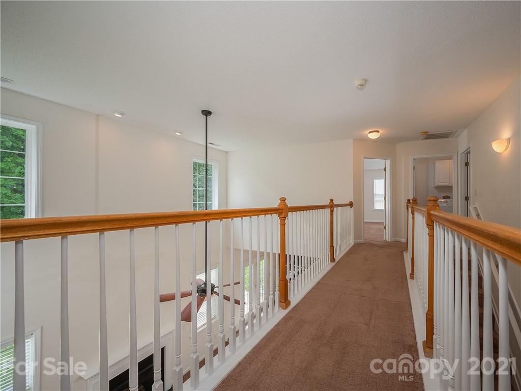 65 Wildbriar Road, Unit 49 Fletcher, NC 28732 - Photo 30 of 43 a view of a hallway with wooden floor