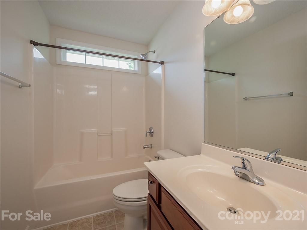 65 Wildbriar Road, Unit 49 Fletcher, NC 28732 - Photo 34 of 43 a bathroom with a sink a toilet and shower