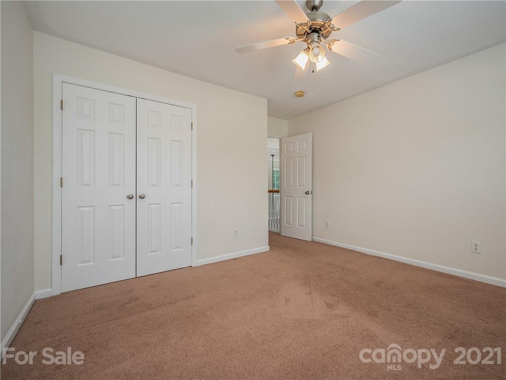 65 Wildbriar Road, Unit 49 Fletcher, NC 28732 - Photo 36 of 43 a view of an empty room and chandelier fan