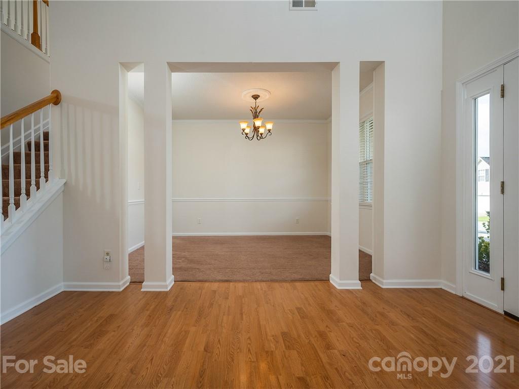65 Wildbriar Road, Unit 49 Fletcher, NC 28732 - Photo 5 of 43 an empty room with wooden floor and windows