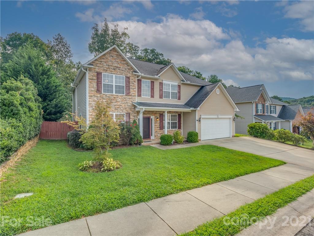 65 Wildbriar Road, Unit 49 Fletcher, NC 28732 - Photo 42 of 43 a front view of a house with a garden