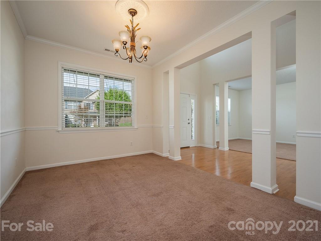 65 Wildbriar Road, Unit 49 Fletcher, NC 28732 - Photo 7 of 43 en empty room with windows and outdoor view