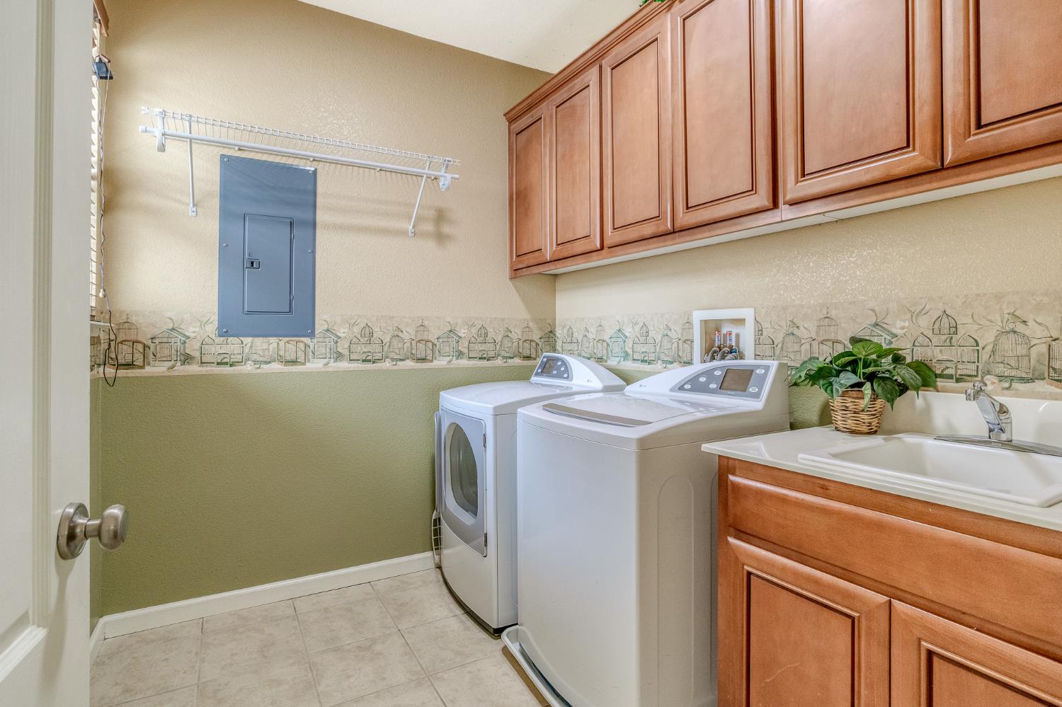 188 Thomsen Road Lathrop, CA 95330 - Photo 20 of 27 a utility room with sink dryer and washer