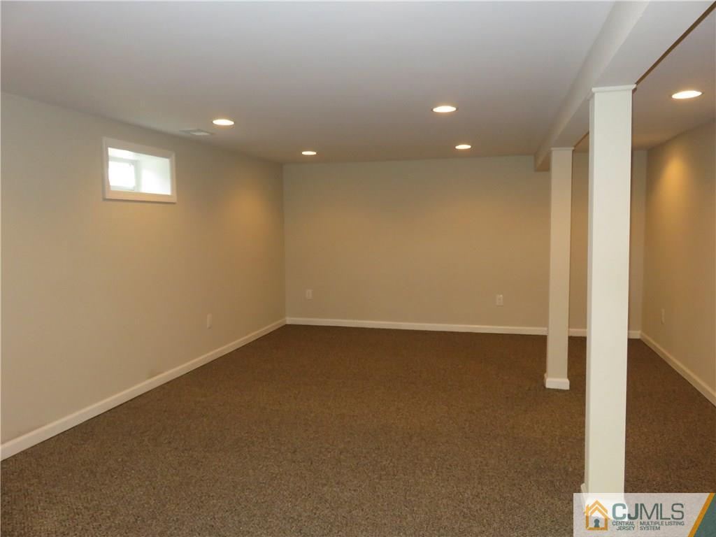 7 Roger Road Edison, NJ 08817 - Photo 12 of 14 an empty room with a empty space and window