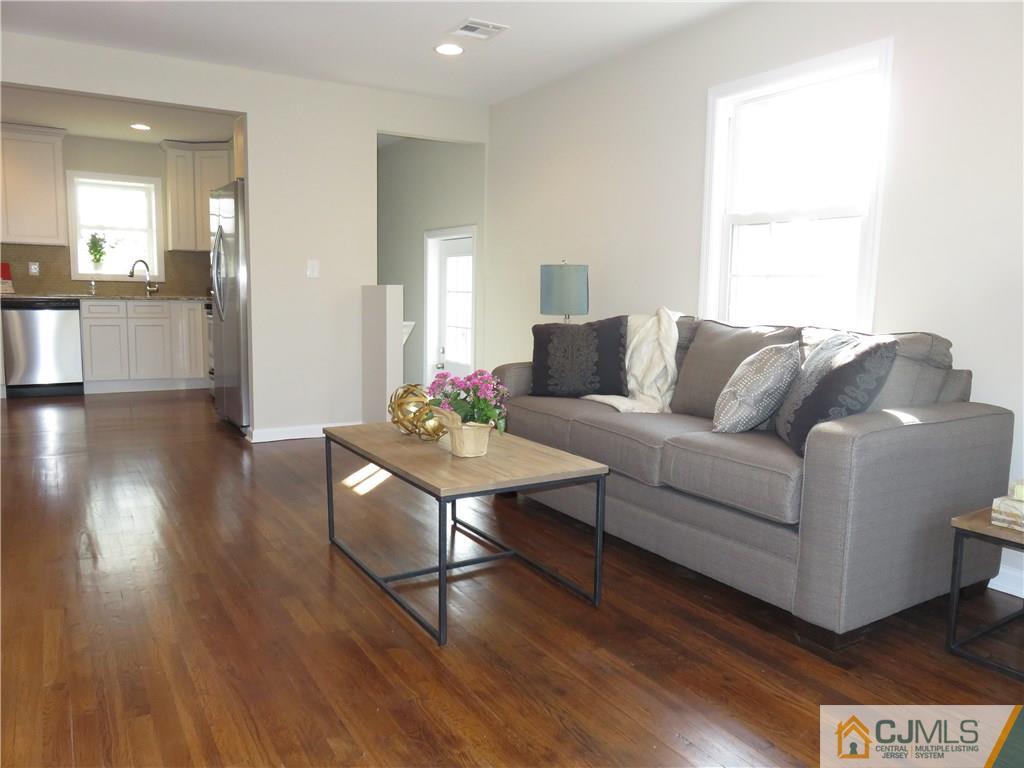 7 Roger Road Edison, NJ 08817 - Photo 7 of 14 a living room with furniture and wooden floor