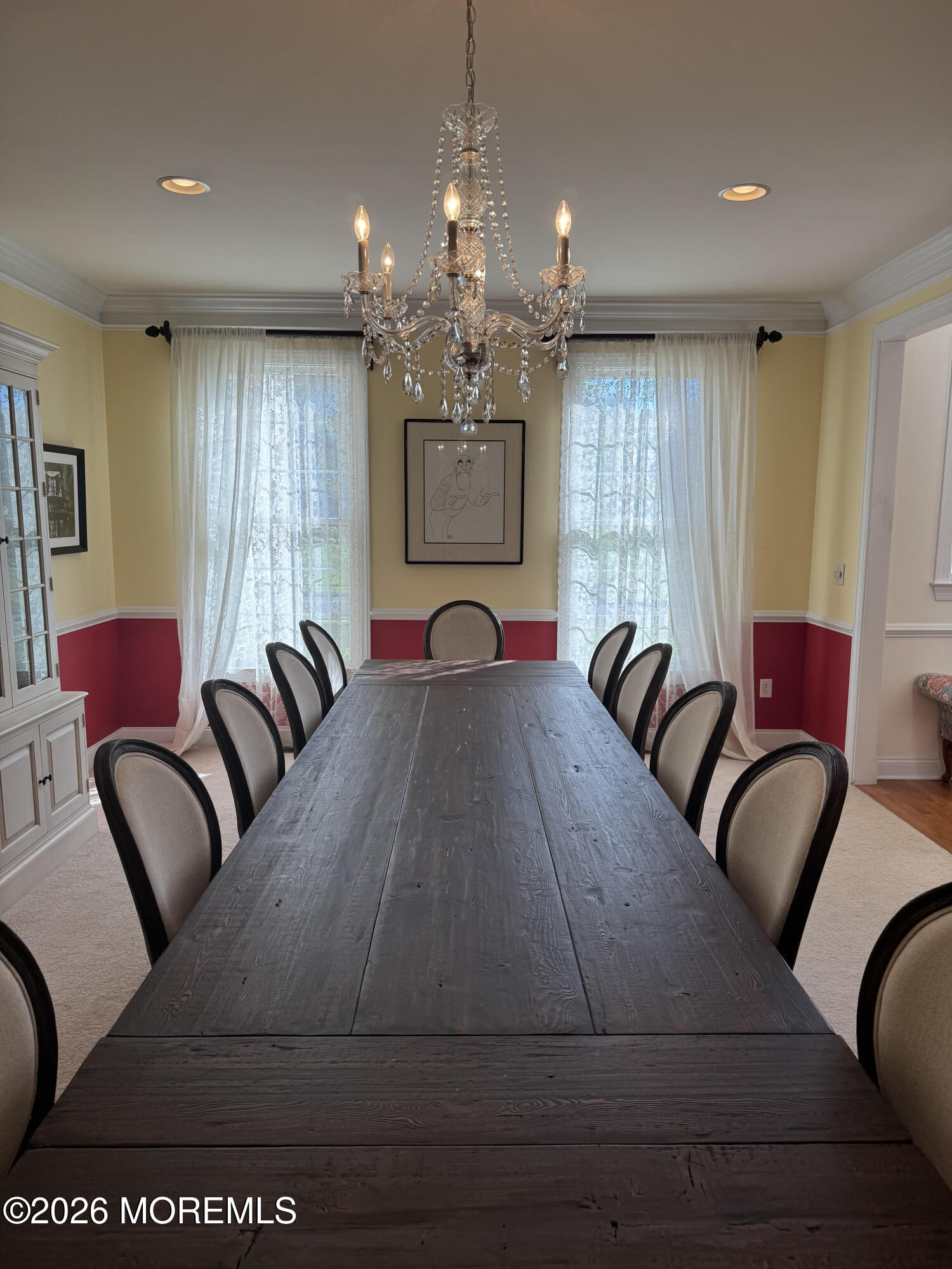 10 Rockingham Court Manalapan, NJ 07726 - Photo 20 of 91 a living room with furniture chandelier and a large window