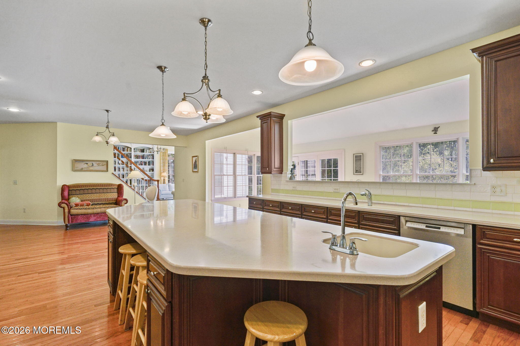10 Rockingham Court Manalapan, NJ 07726 - Photo 24 of 91 a kitchen with kitchen island a sink appliances and a counter top space