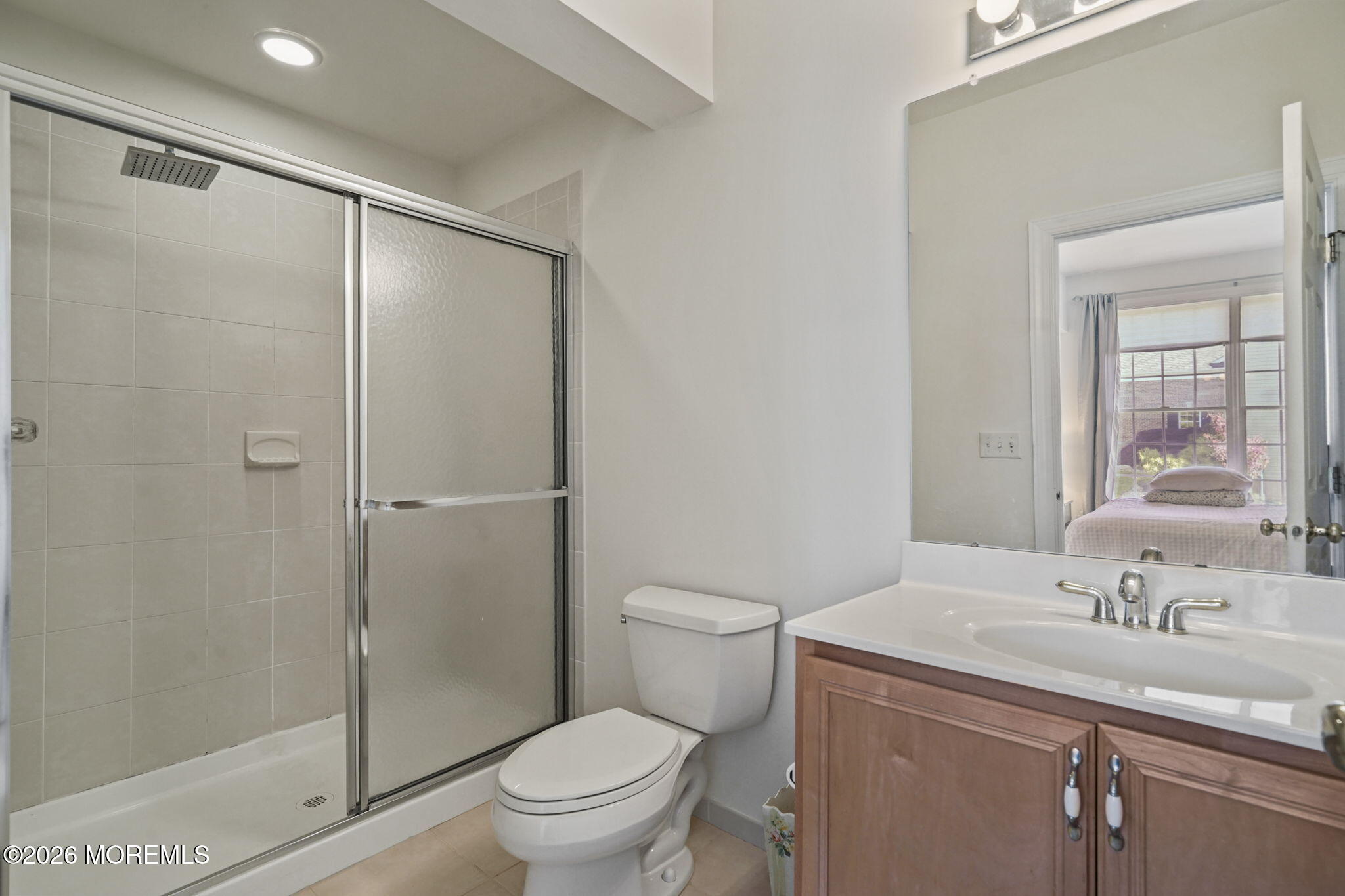 10 Rockingham Court Manalapan, NJ 07726 - Photo 35 of 91 a bathroom with a granite countertop sink toilet and shower