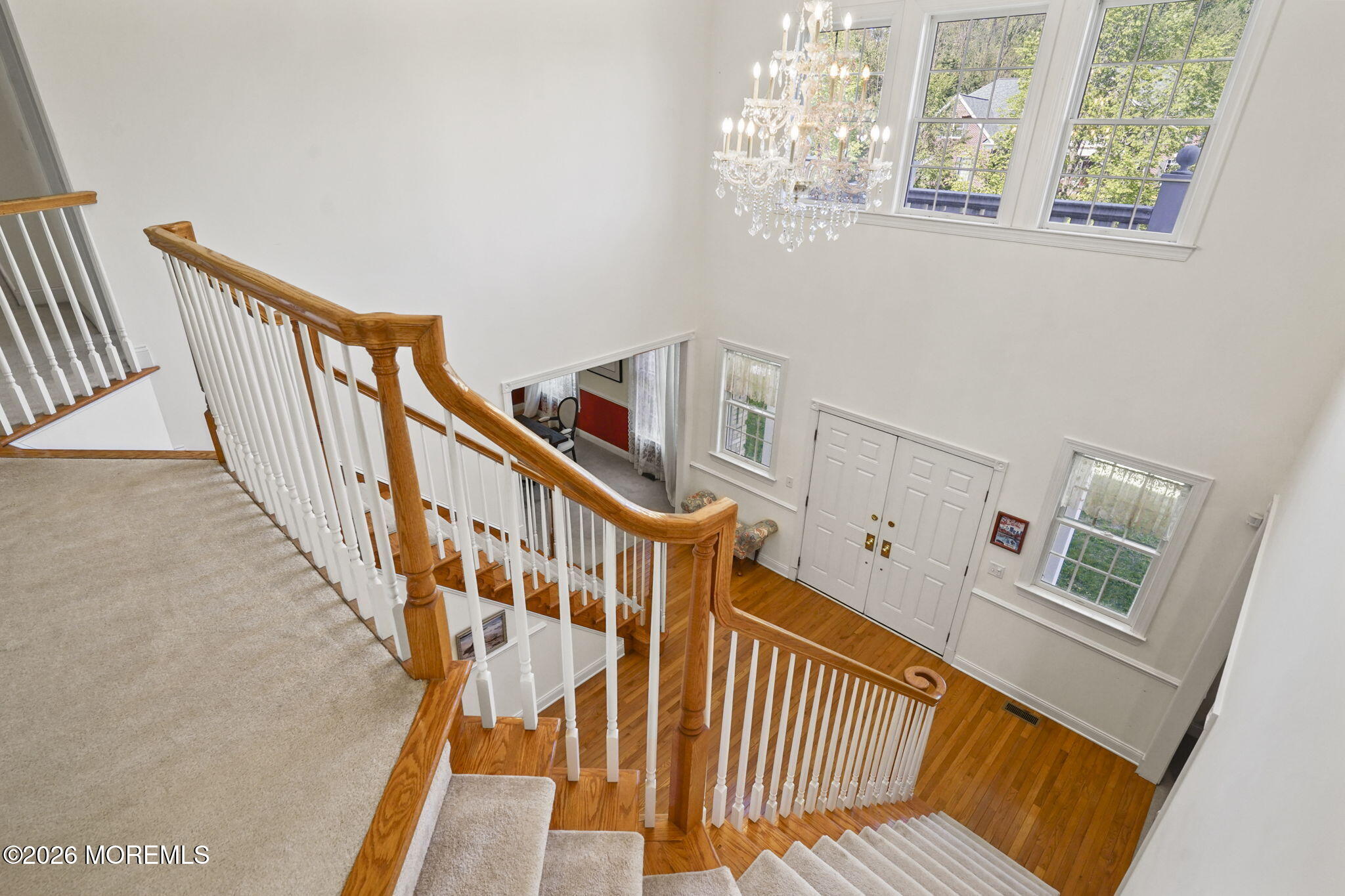 10 Rockingham Court Manalapan, NJ 07726 - Photo 37 of 91 a view of entryway with wooden floor and stairs