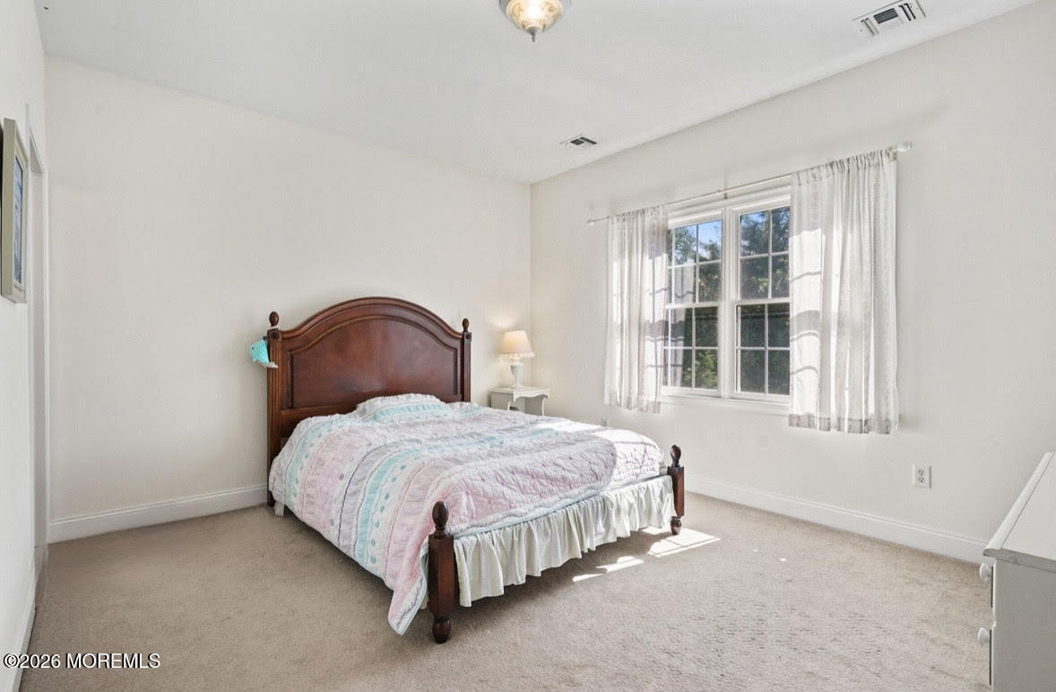 10 Rockingham Court Manalapan, NJ 07726 - Photo 51 of 91 a bedroom with a bed and a window