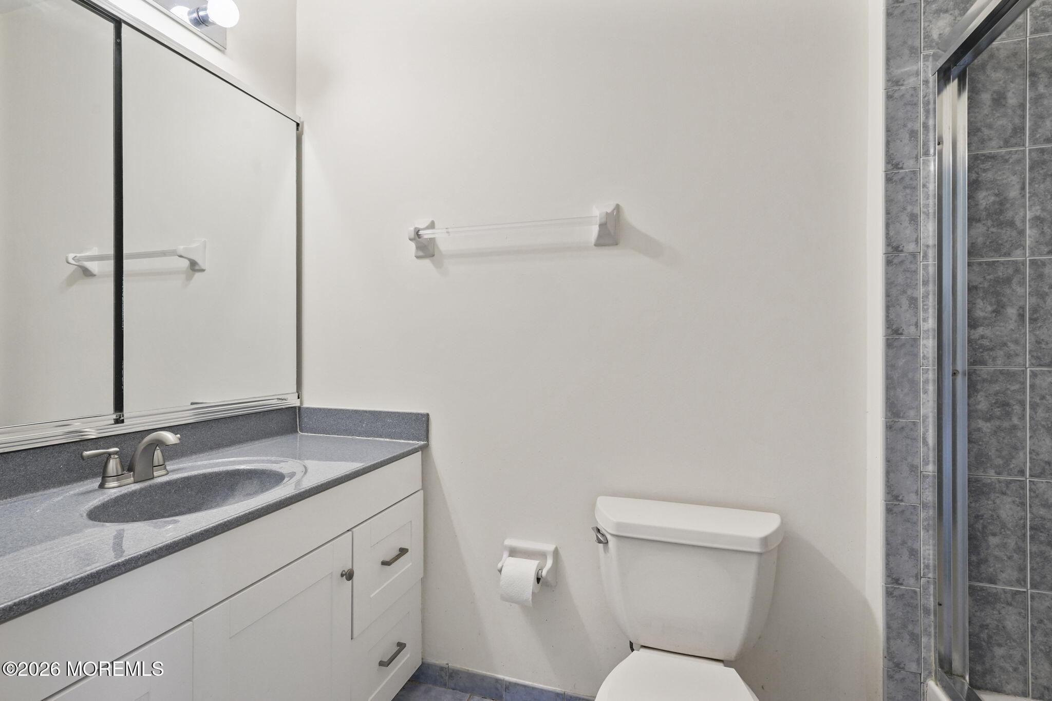 10 Rockingham Court Manalapan, NJ 07726 - Photo 56 of 91 a bathroom with a granite countertop sink toilet and shower