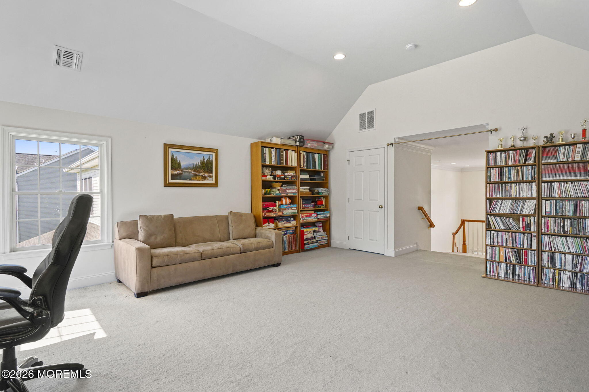 10 Rockingham Court Manalapan, NJ 07726 - Photo 58 of 91 a living room with furniture and a flat screen tv