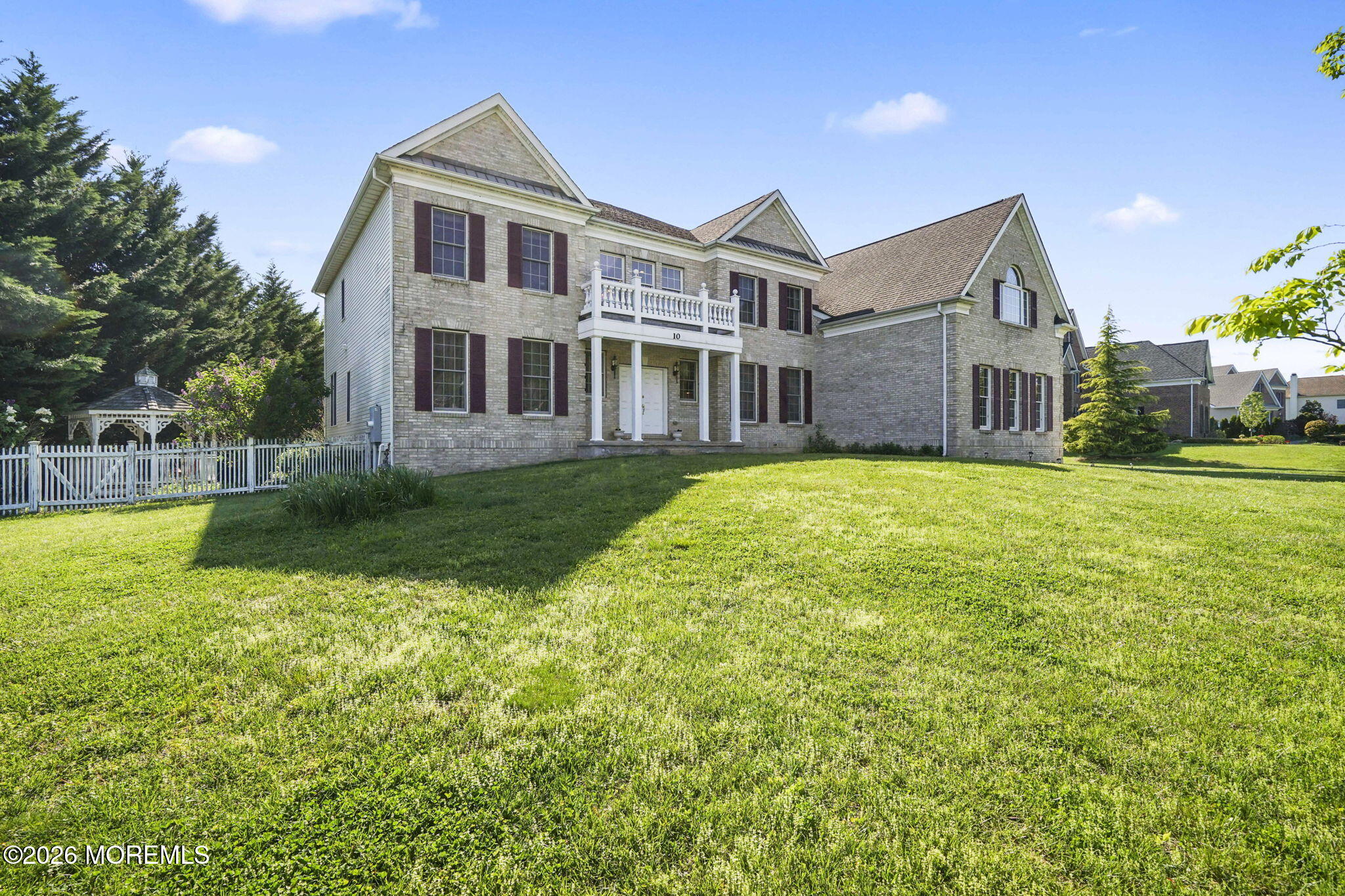 10 Rockingham Court Manalapan, NJ 07726 - Photo 74 of 91 a front view of a house with a yard