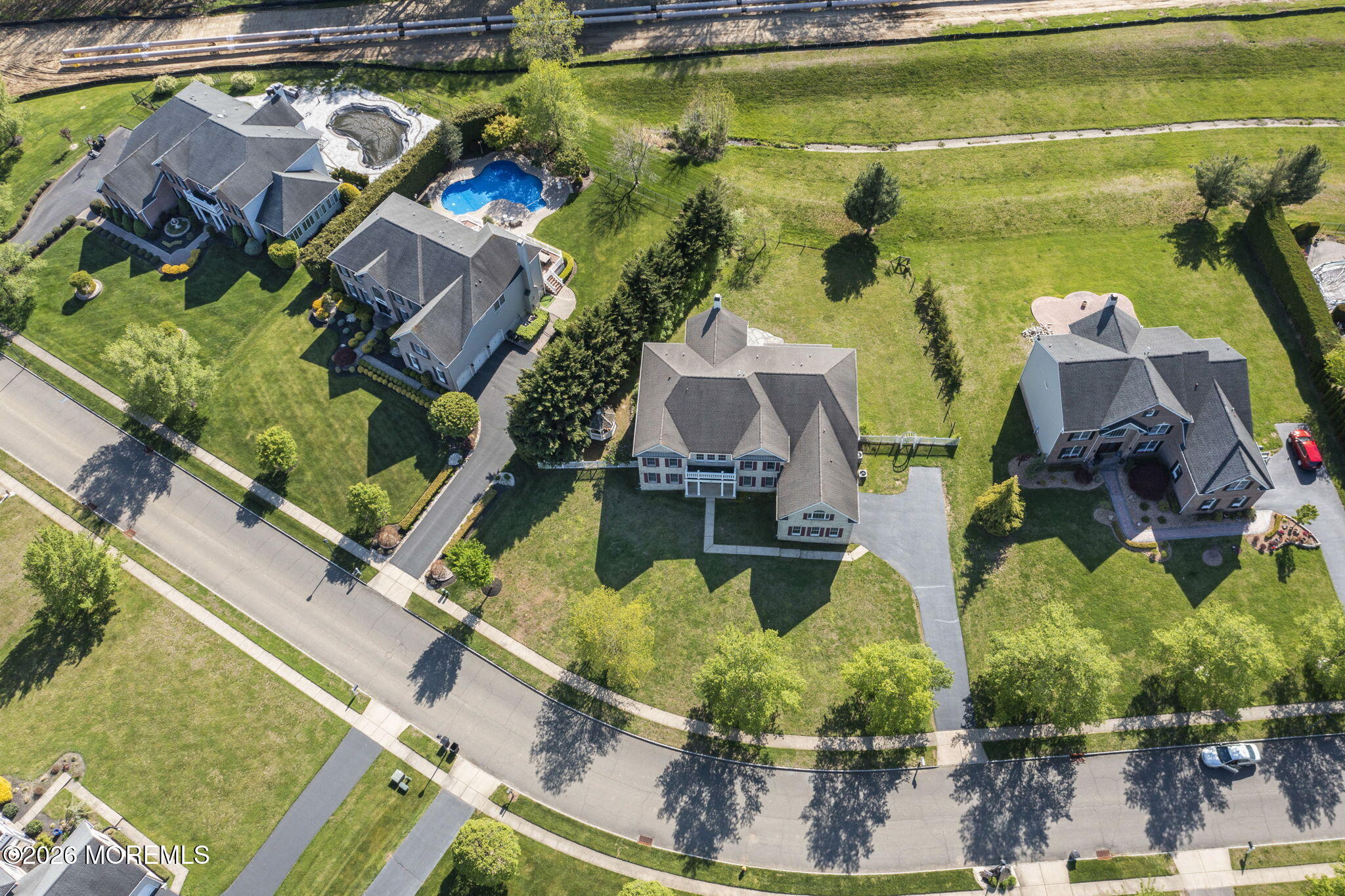 10 Rockingham Court Manalapan, NJ 07726 - Photo 78 of 91 an aerial view of residential houses with outdoor space
