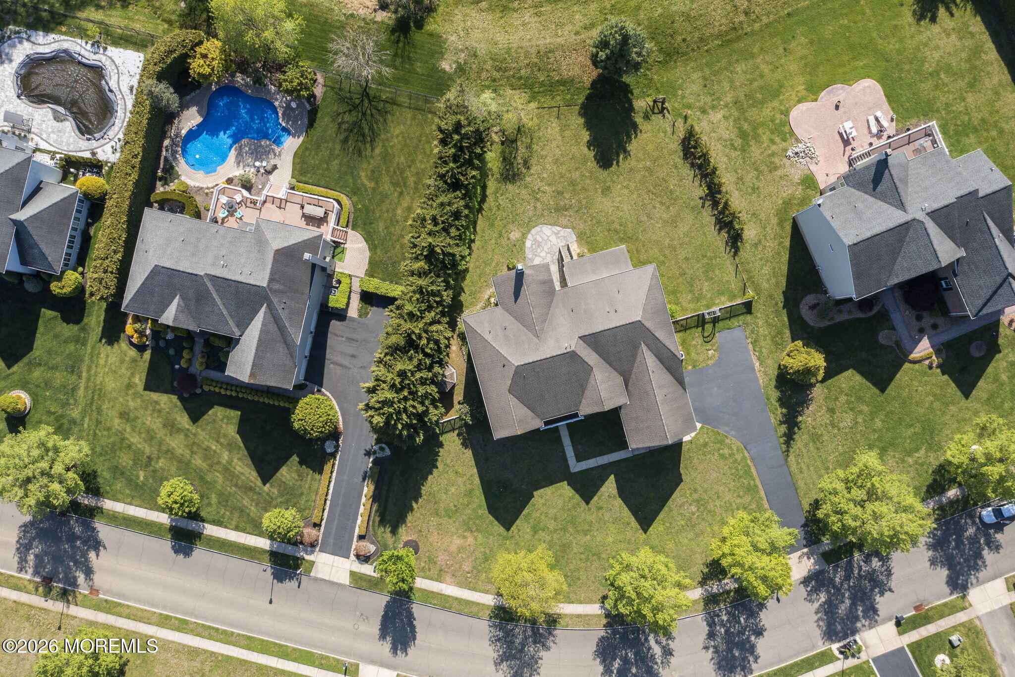 10 Rockingham Court Manalapan, NJ 07726 - Photo 80 of 91 an aerial view of multiple houses with yard