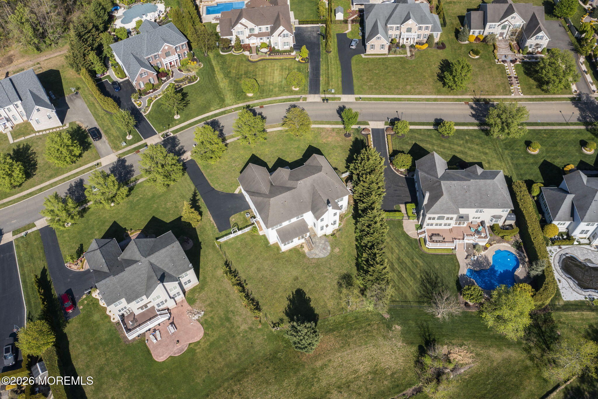 10 Rockingham Court Manalapan, NJ 07726 - Photo 82 of 91 an aerial view of a house with a swimming pool