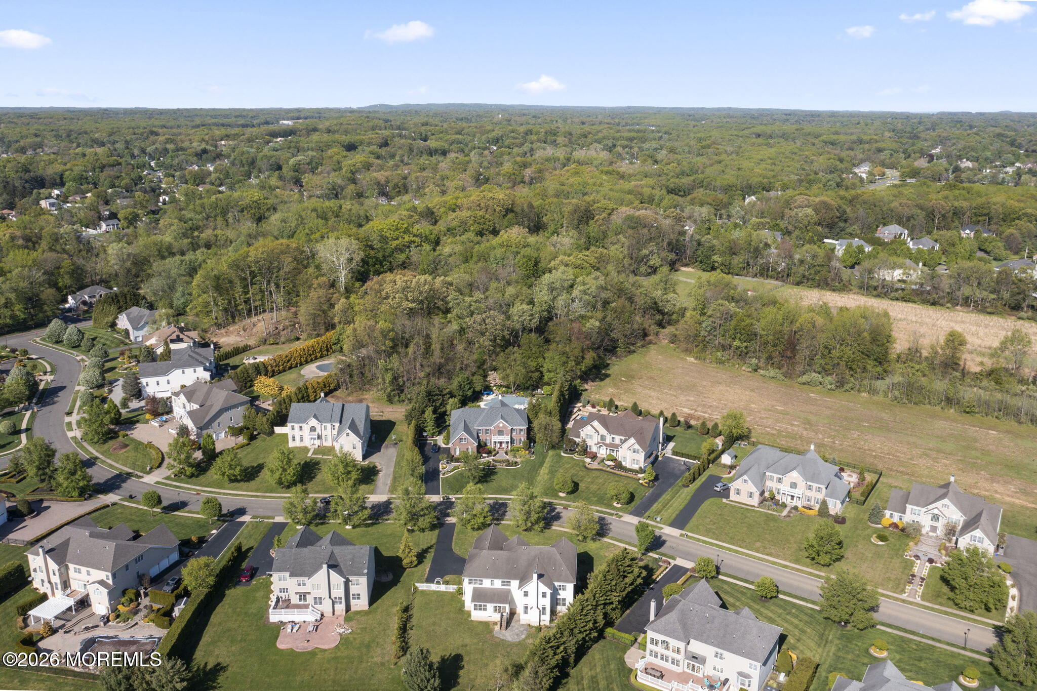 10 Rockingham Court Manalapan, NJ 07726 - Photo 84 of 91 an aerial view of a city with lots of residential buildings