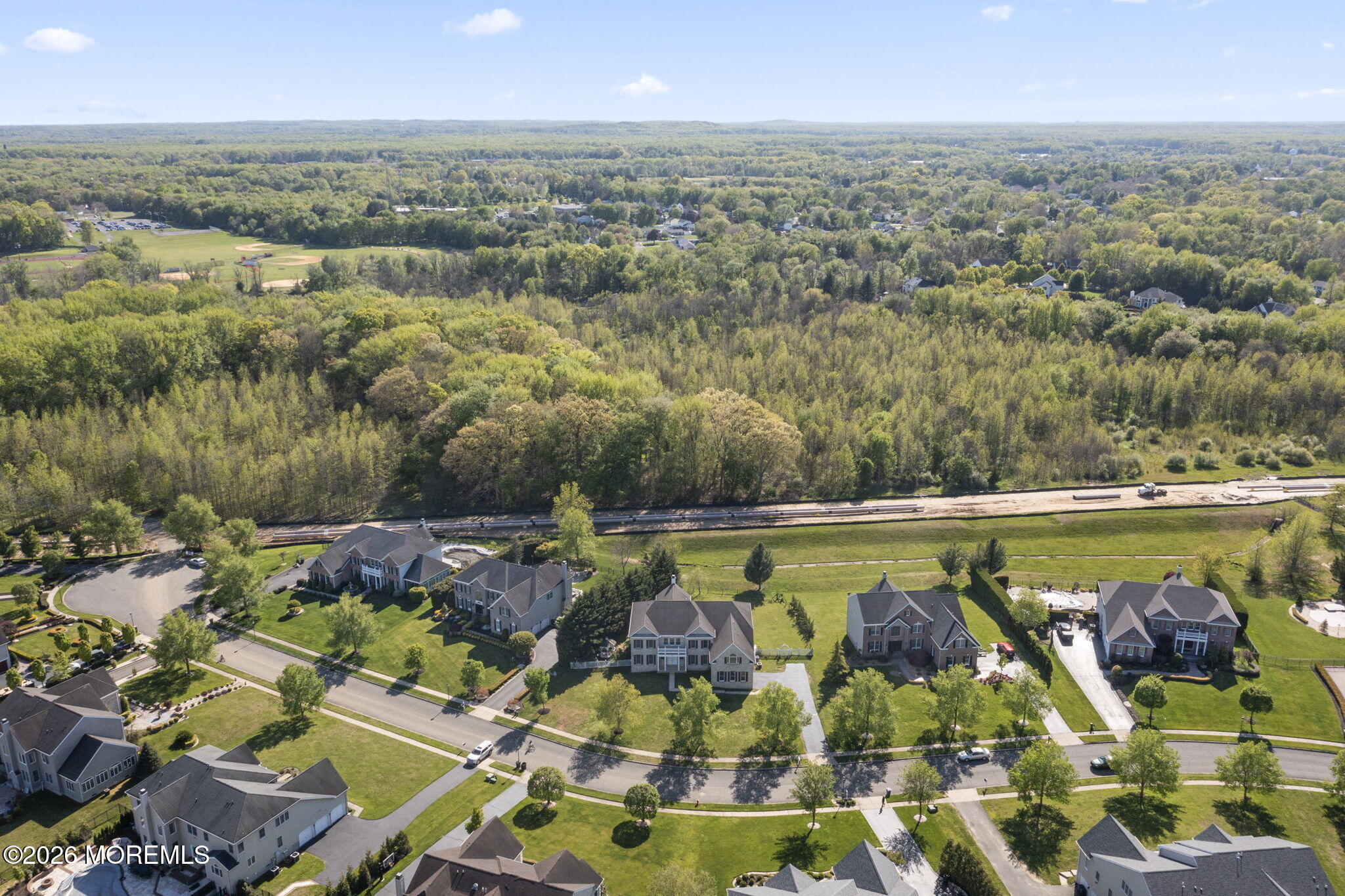 10 Rockingham Court Manalapan, NJ 07726 - Photo 87 of 91 an aerial view of residential houses with outdoor space and lake view