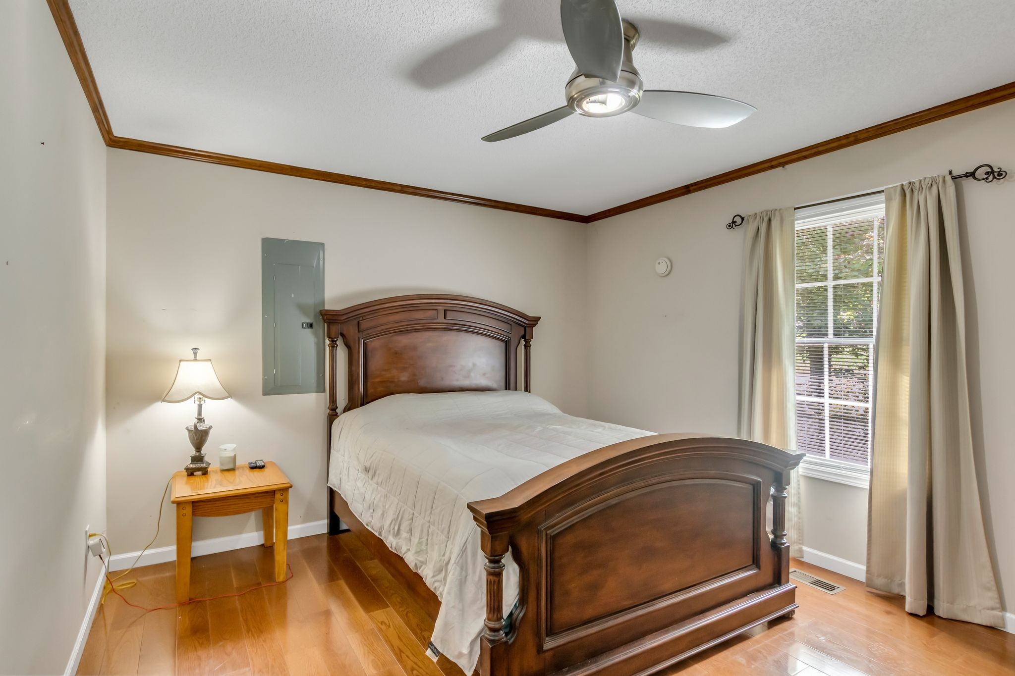 184 Buncombe Road Belvidere, TN 37306 - Photo 21 of 33 a bedroom with a bed and a chandelier