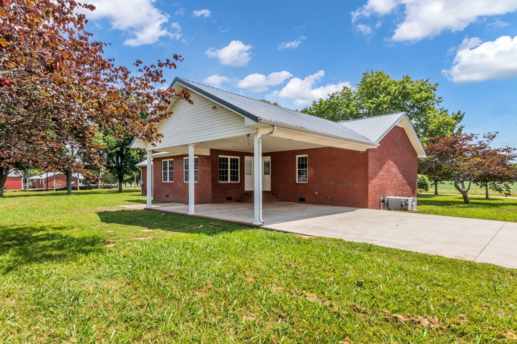 184 Buncombe Road Belvidere, TN 37306 - Photo 30 of 33 a front view of a house with a yard and garage