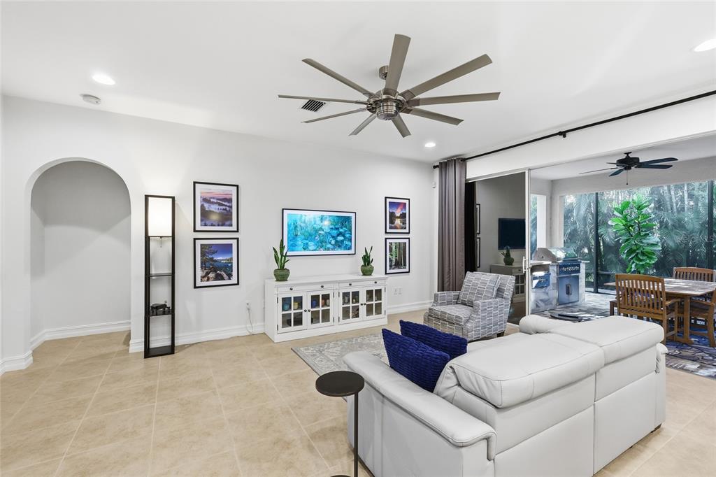 12106 Perennial Place Lakewood Ranch, FL 34211 - Photo 11 of 66 a living room with furniture and a large window
