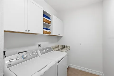 a view of a workspace with furniture and a bookshelf