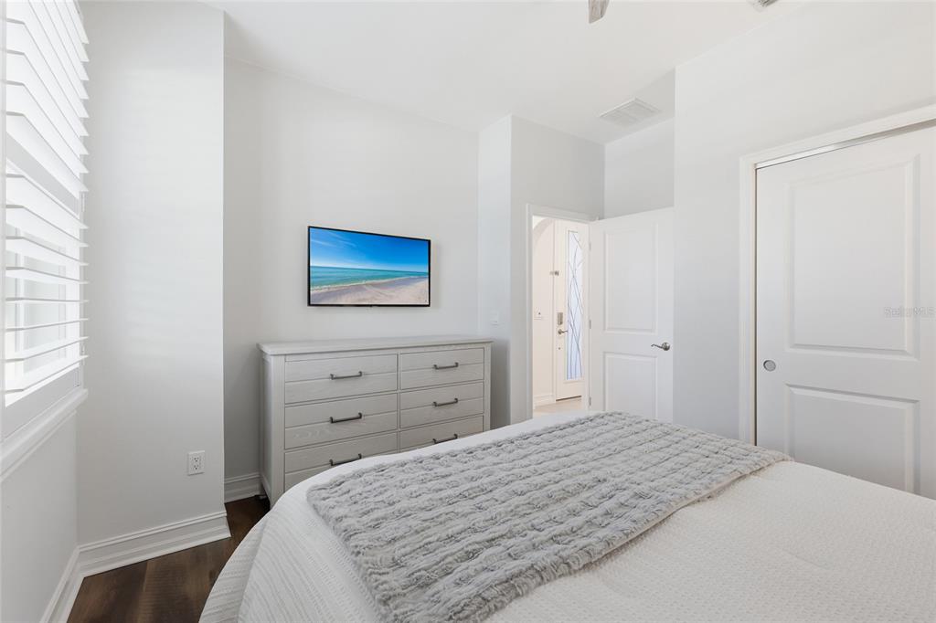 12106 Perennial Place Lakewood Ranch, FL 34211 - Photo 27 of 66 a bedroom with a bed and a dresser