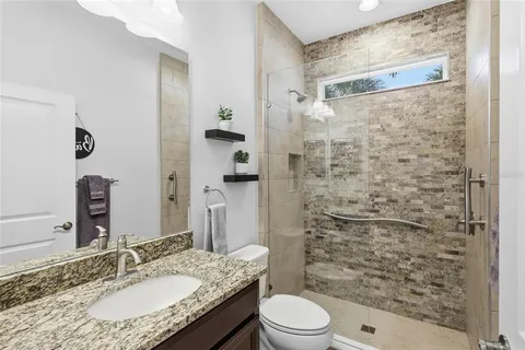 an aerial view of residential houses and lake view