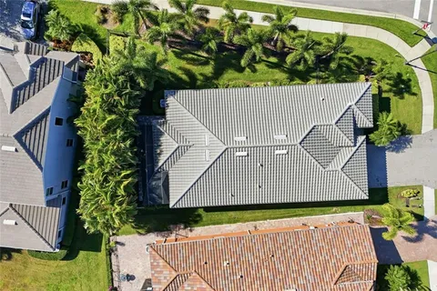 a living room with fireplace furniture and a large window