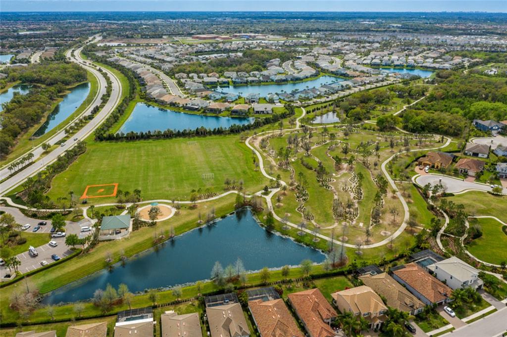 12106 Perennial Place Lakewood Ranch, FL 34211 - Photo 41 of 66 an aerial view of residential houses with outdoor space