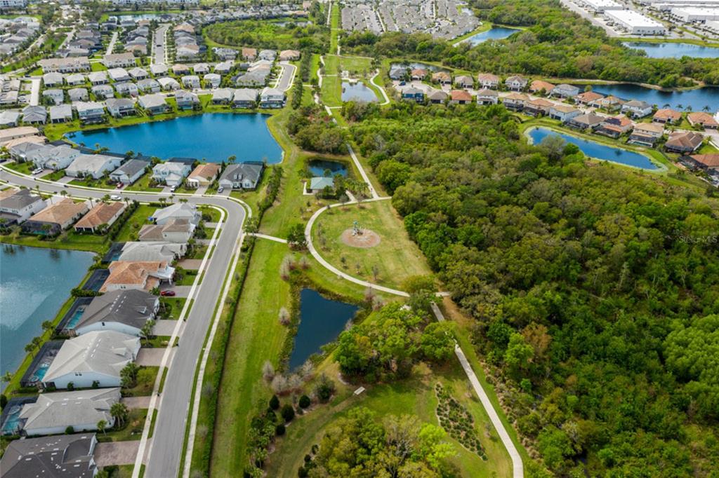 12106 Perennial Place Lakewood Ranch, FL 34211 - Photo 43 of 66 an aerial view of residential houses with outdoor space