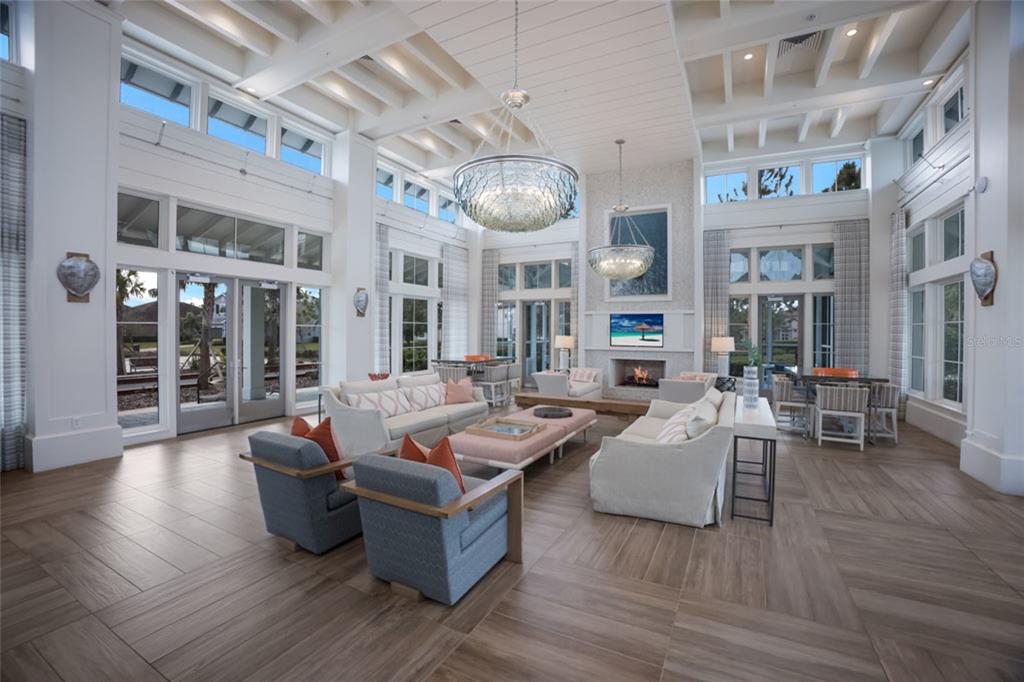 12106 Perennial Place Lakewood Ranch, FL 34211 - Photo 46 of 66 a living room with patio furniture and wooden floor
