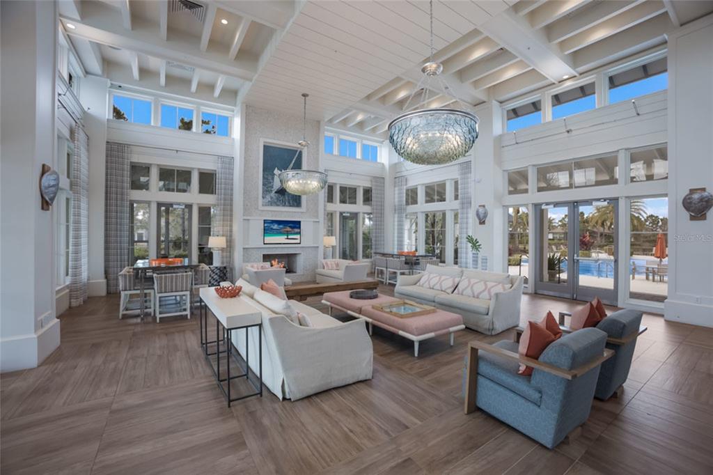 12106 Perennial Place Lakewood Ranch, FL 34211 - Photo 48 of 66 a living room with fireplace furniture and a large window