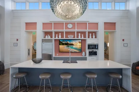 a view of a house with swimming pool and sitting area