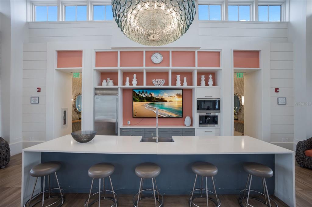 12106 Perennial Place Lakewood Ranch, FL 34211 - Photo 50 of 66 a view of a dining room with furniture and wooden floor