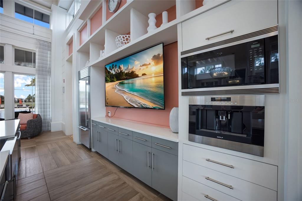 12106 Perennial Place Lakewood Ranch, FL 34211 - Photo 51 of 66 a living room with furniture and a flat screen tv