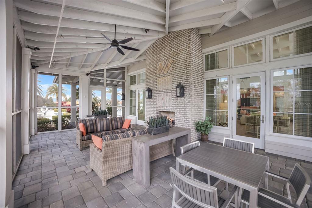 12106 Perennial Place Lakewood Ranch, FL 34211 - Photo 54 of 66 a outdoor space with lots of white furniture