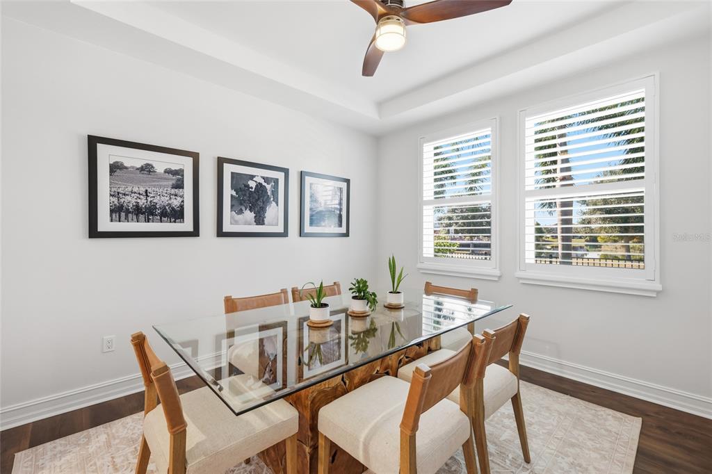12106 Perennial Place Lakewood Ranch, FL 34211 - Photo 9 of 66 a dining room with furniture and window