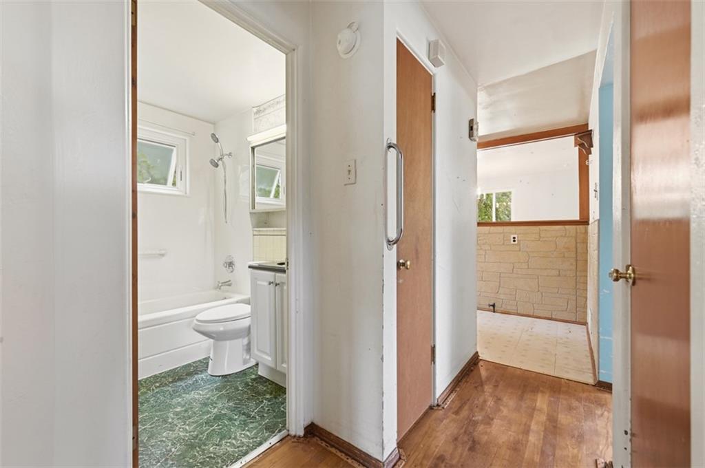 328 Ruthwood Avenue Pittsburgh, PA 15227 - Photo 11 of 32 a bathroom with a granite countertop toilet a sink and a mirror
