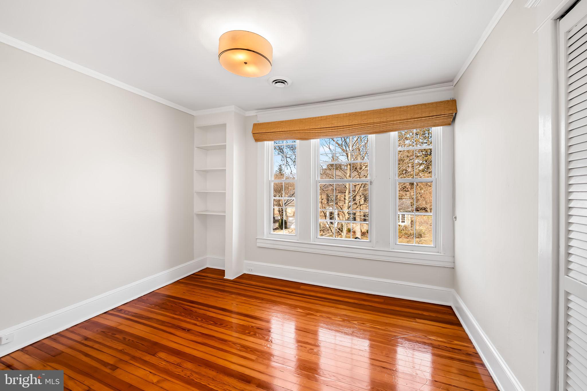 703 Chumleigh Road Baltimore, MD 21212 - Photo 21 of 41 a view of a room with window and wooden floor